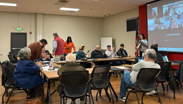 Members of the Pikesville Improvement Corporation at a community meeting